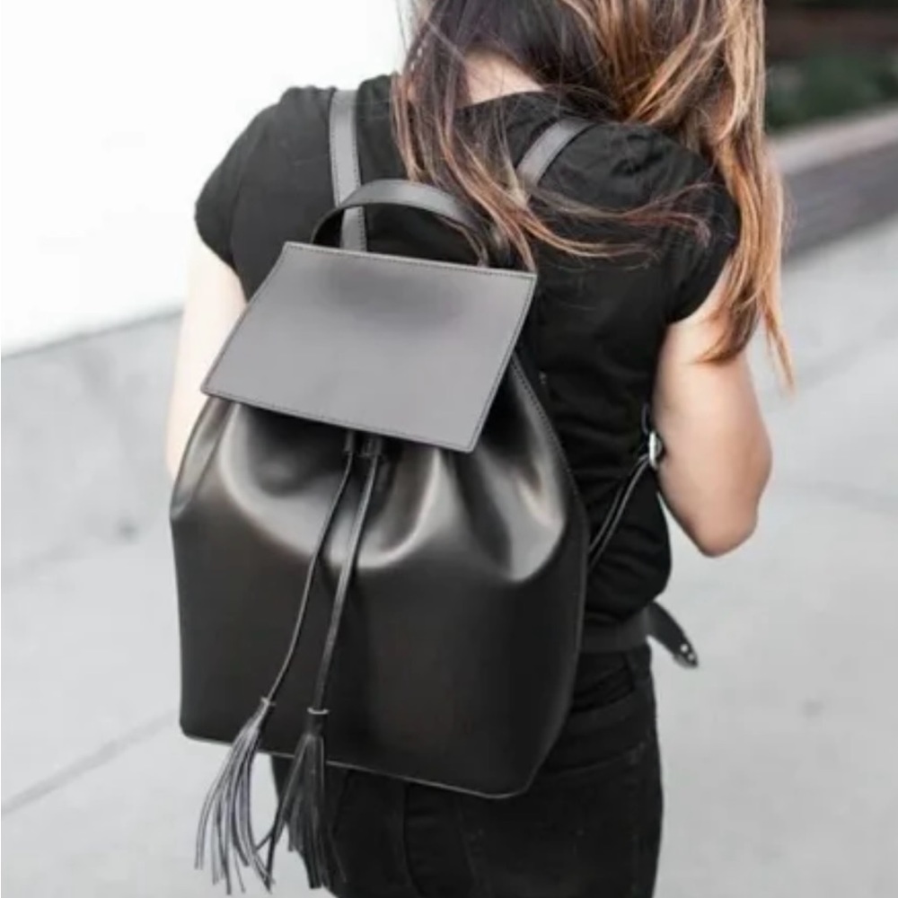 black leather, backpack by Camelia Roma.
